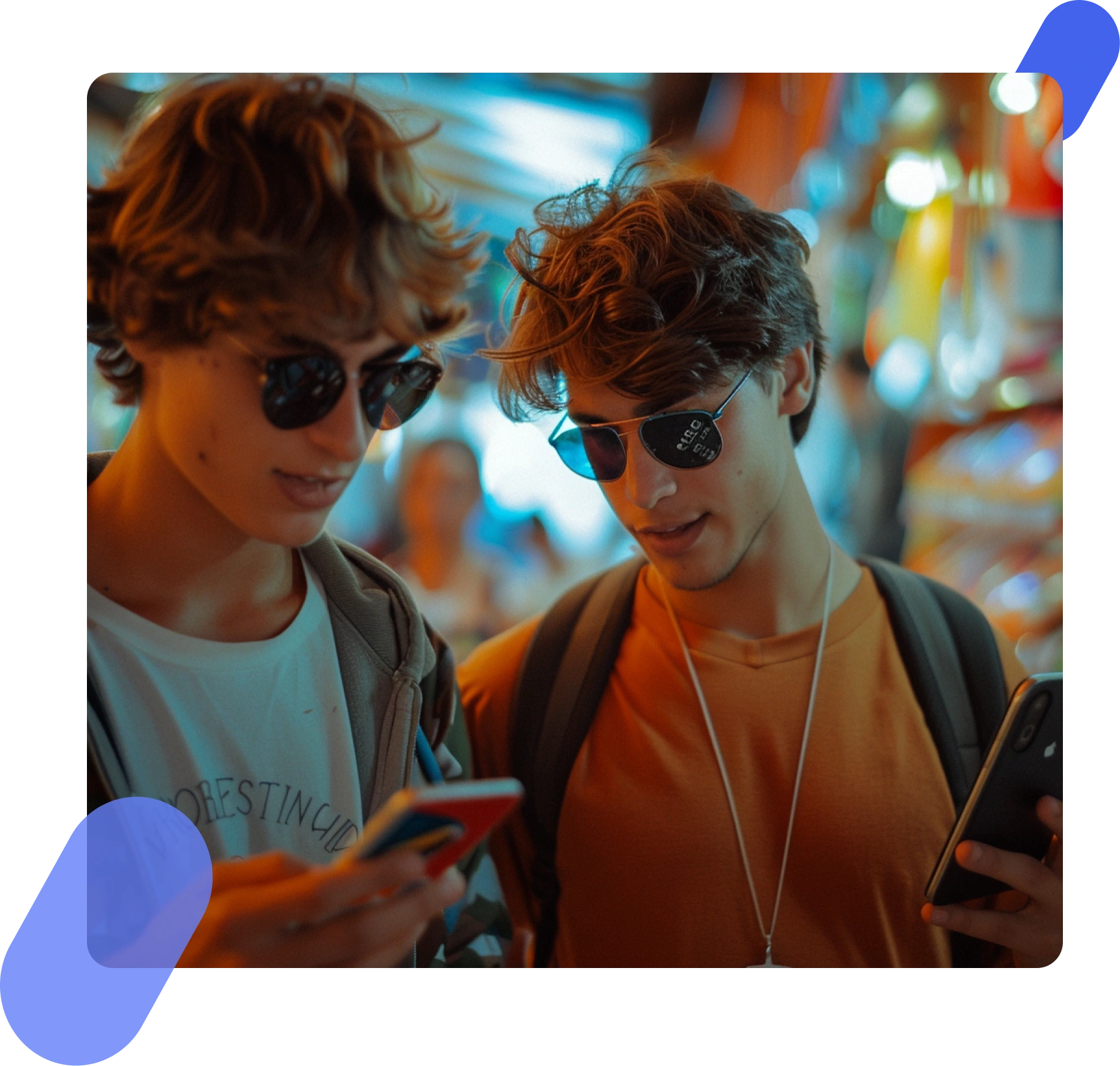 Image of two young individuals looking at a cellphone screen together, engaged in shared digital content or conversation.